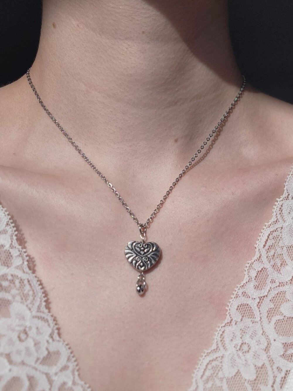 Silver heart necklace with a small silver chain